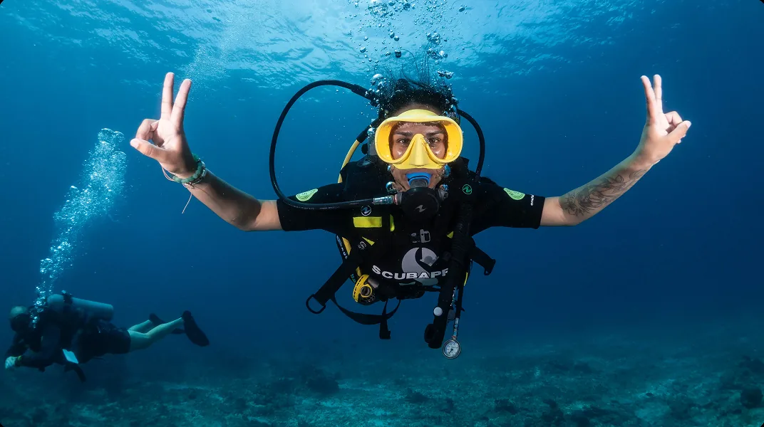 A diver over the reef a few minutes off the coast of Gili Air