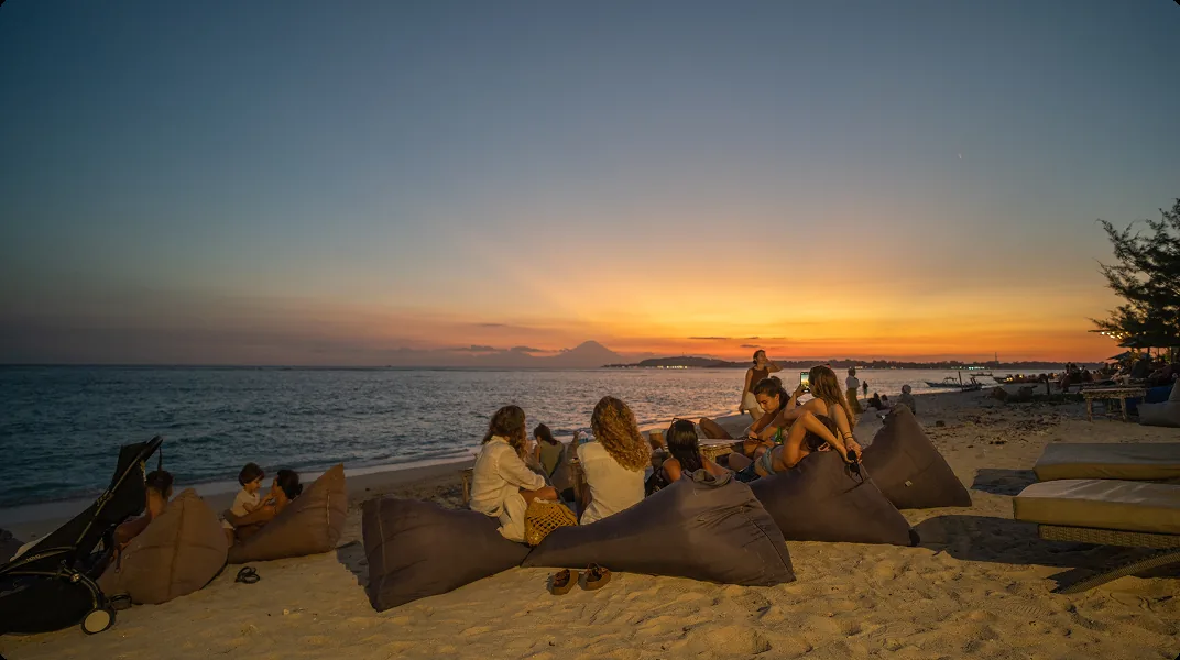 Peach and gold sky over the strait to Lombok from the west beach on Gili Air